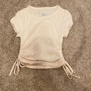 White top with singed sides with bows